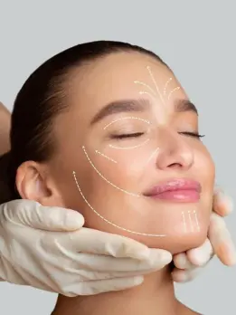 A cosmetic treatment is carried out on a lady to improve the definition and contours of her face.