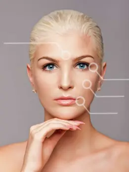 A woman with a line on her face demonstrates enhanced facial aesthetics against a white backdrop.