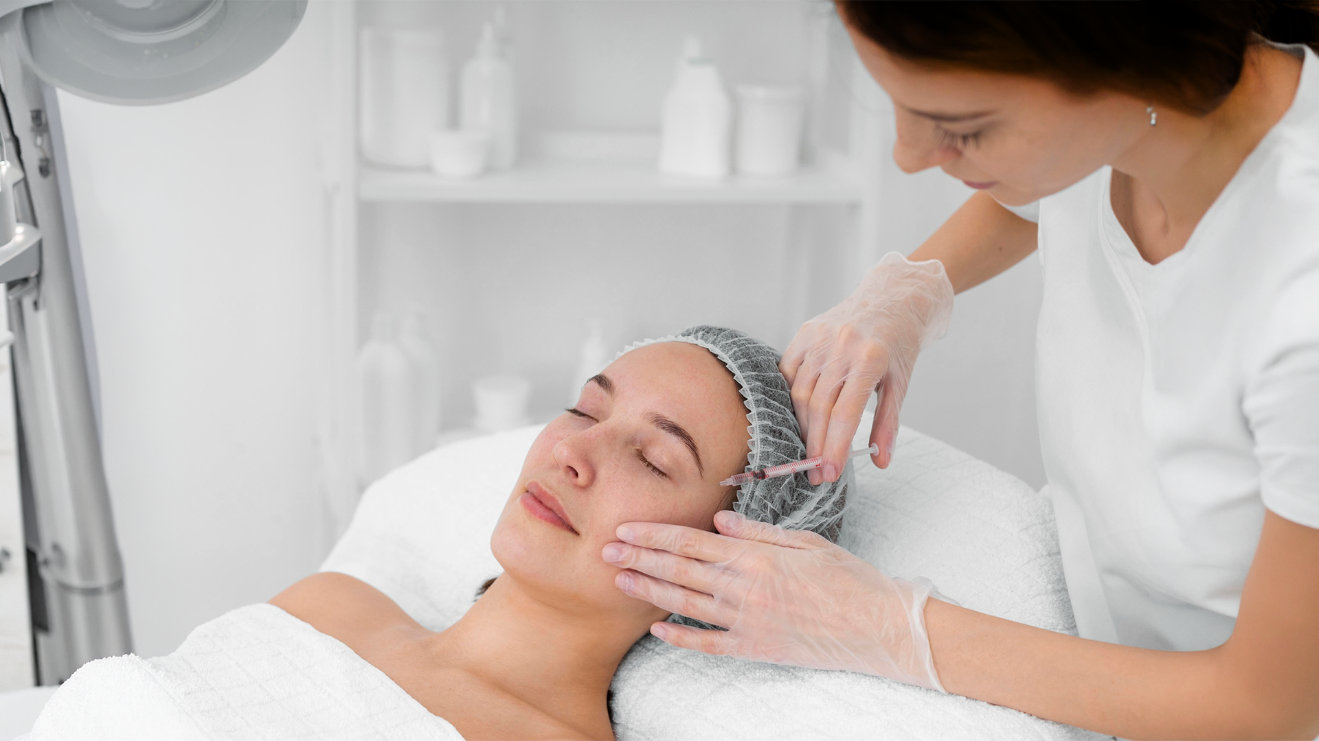 Dermatologist performing anti-ageing facial treatment in Erode