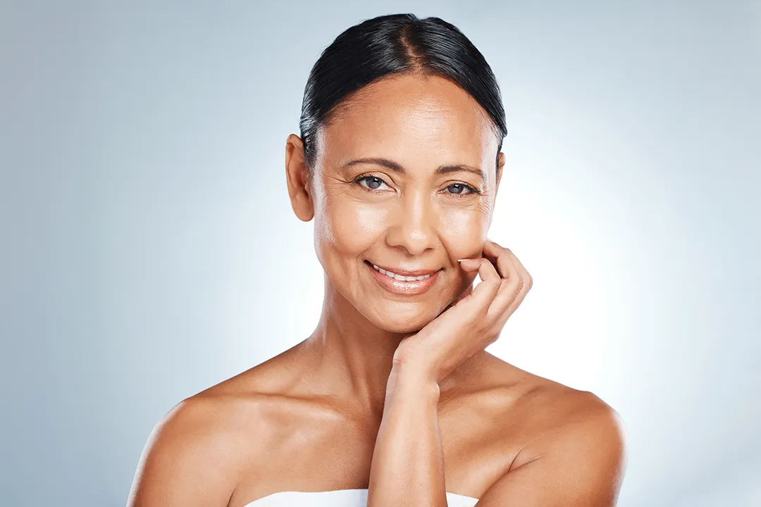 Anti-aging skin treatment – mature woman with smooth, youthful skin after cosmetic procedure